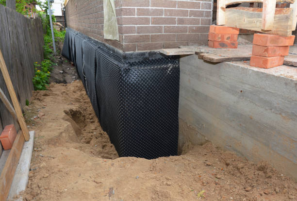 SJ Waterproofing Pros technician performing targeted Exterior Waterproofing assessment in Mantua, VA